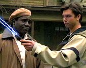 Rembrandt Brown and Quinn Mallory as Quinn opens the wormhole for the next slide; played by Cleavant Derricks and Jerry O'Connell